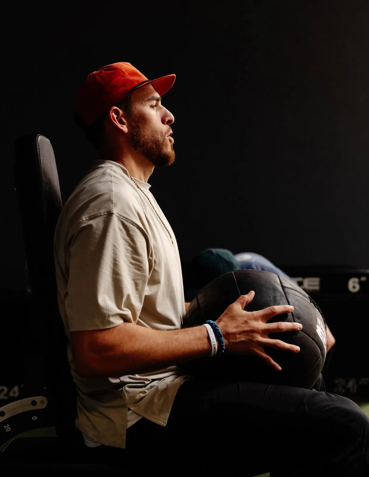 Joe Musgrove seated with a medicine ball during a controlled assessment movement